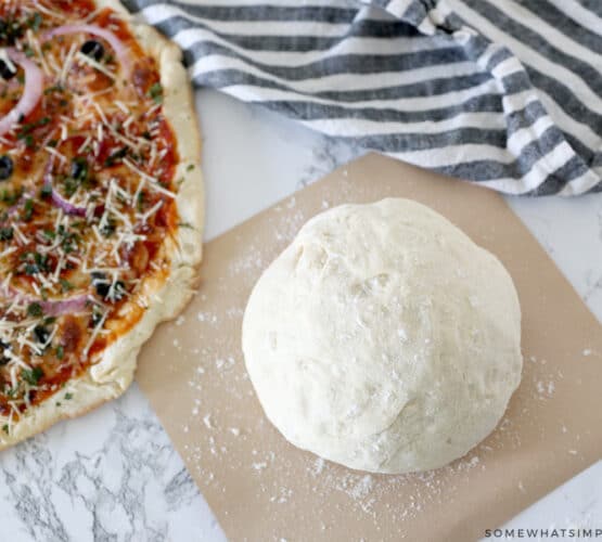 ball of dough next to a pizza