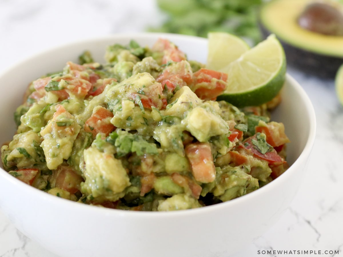 close up of a bowl filled with avocado salsa