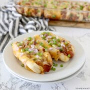 baked chili dogs served on a white plate