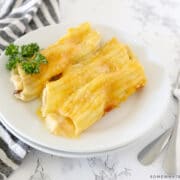 chicken manicotti on a white dinner plate