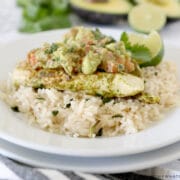 cilantro lime chicken on a bed of rice with avocado salsa on top