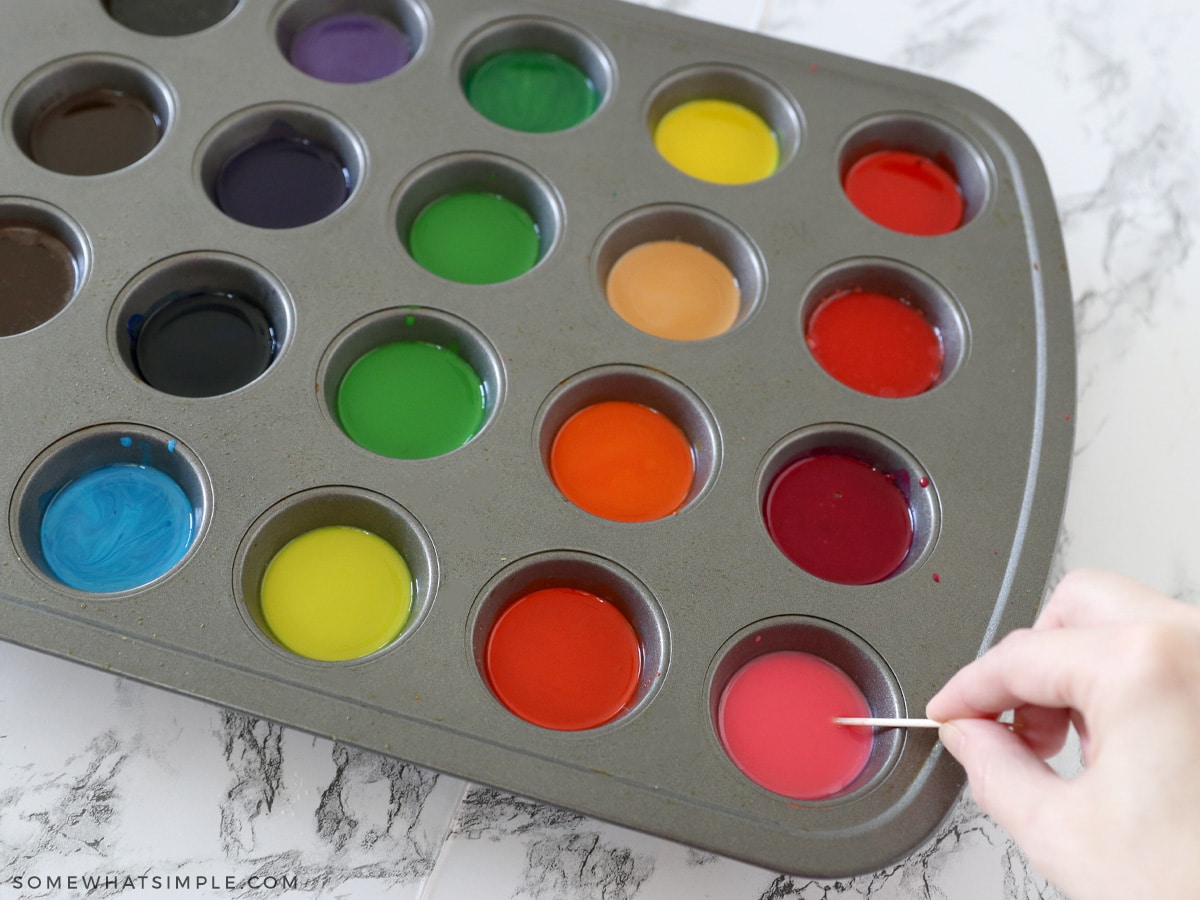 melting old crayons in a muffin tin