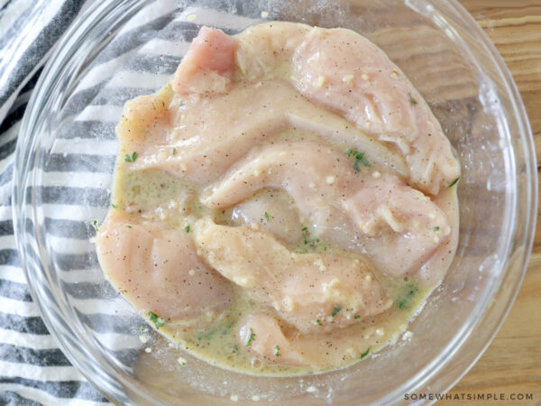 chicken cutlets in an egg mixture