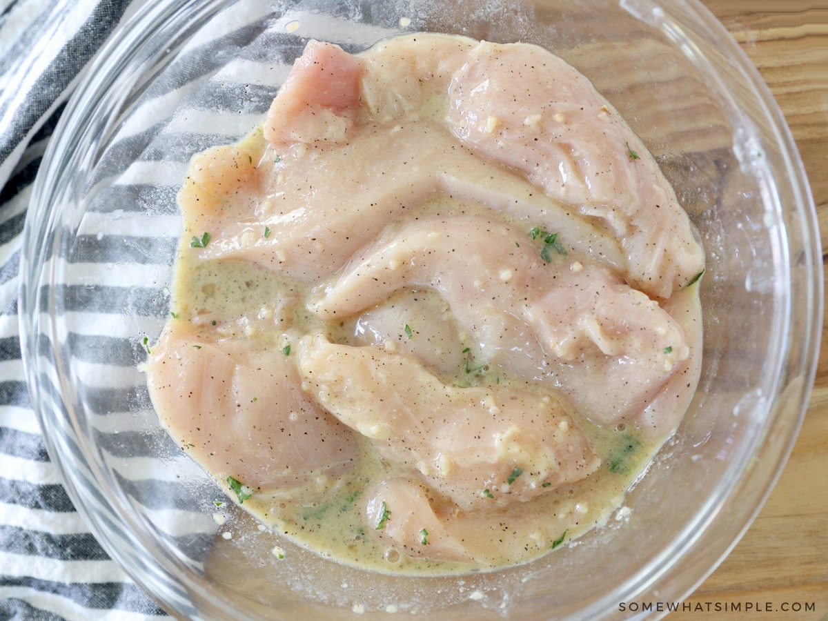 chicken cutlets in an egg mixture