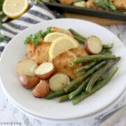 stacked plates with lemon parmesan chicken on top