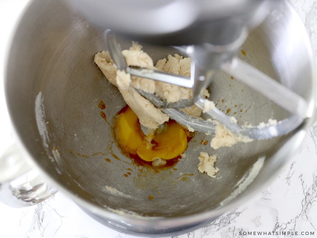 adding egg to cookie ingredients