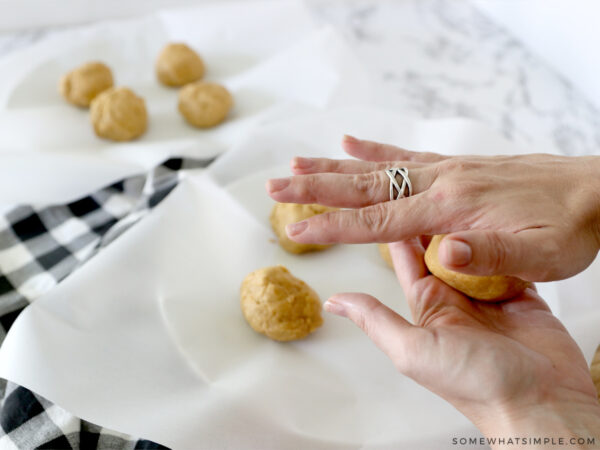 making balls of pumpkin sugar cookies