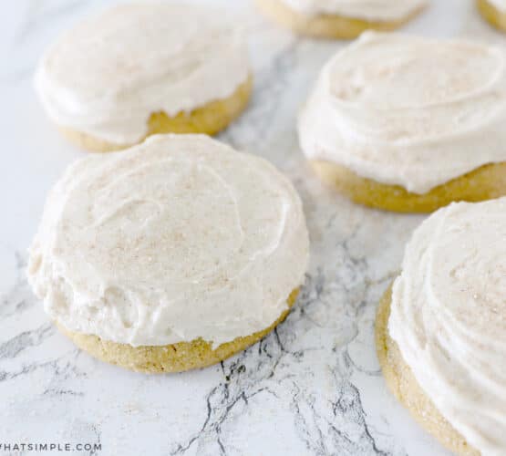 pumpkin sugar cookies on a white counter