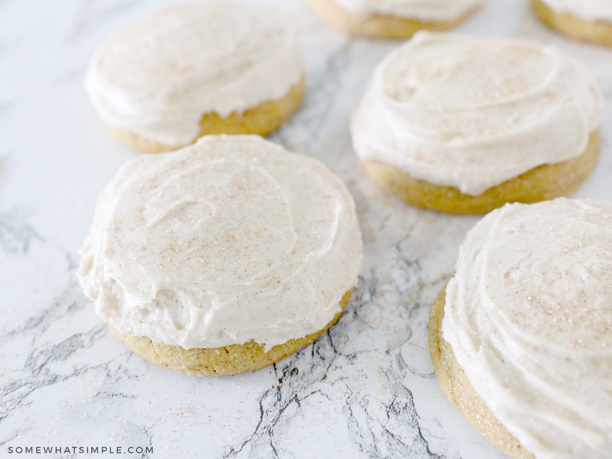 pumpkin sugar cookies on a white counter