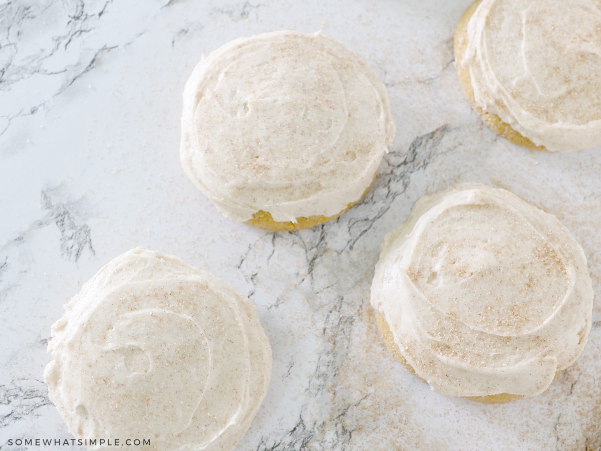 pumpkin sugar cookies on a white counter