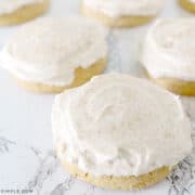 pumpkin sugar cookies frosted with cinnamon cream cheese frosting