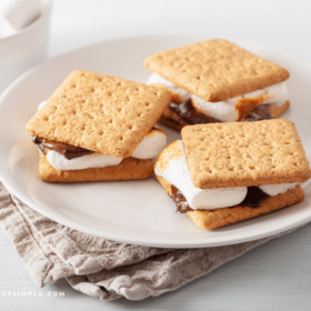 3 smores on a white plate