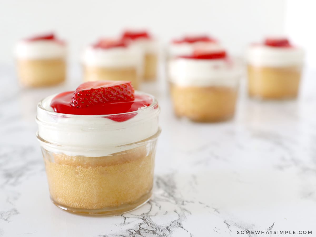 small mason jars with cake inside each of them