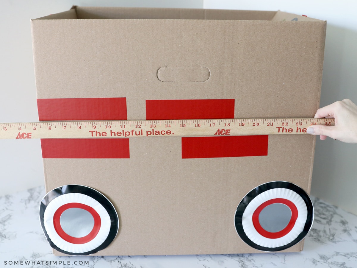 applying vinyl to a cardboard car