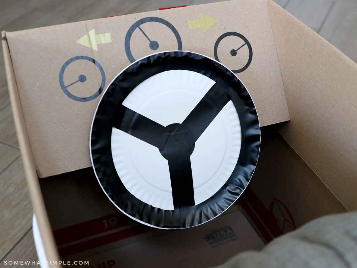 making a steering wheel from a paper plate and vinyl stickers