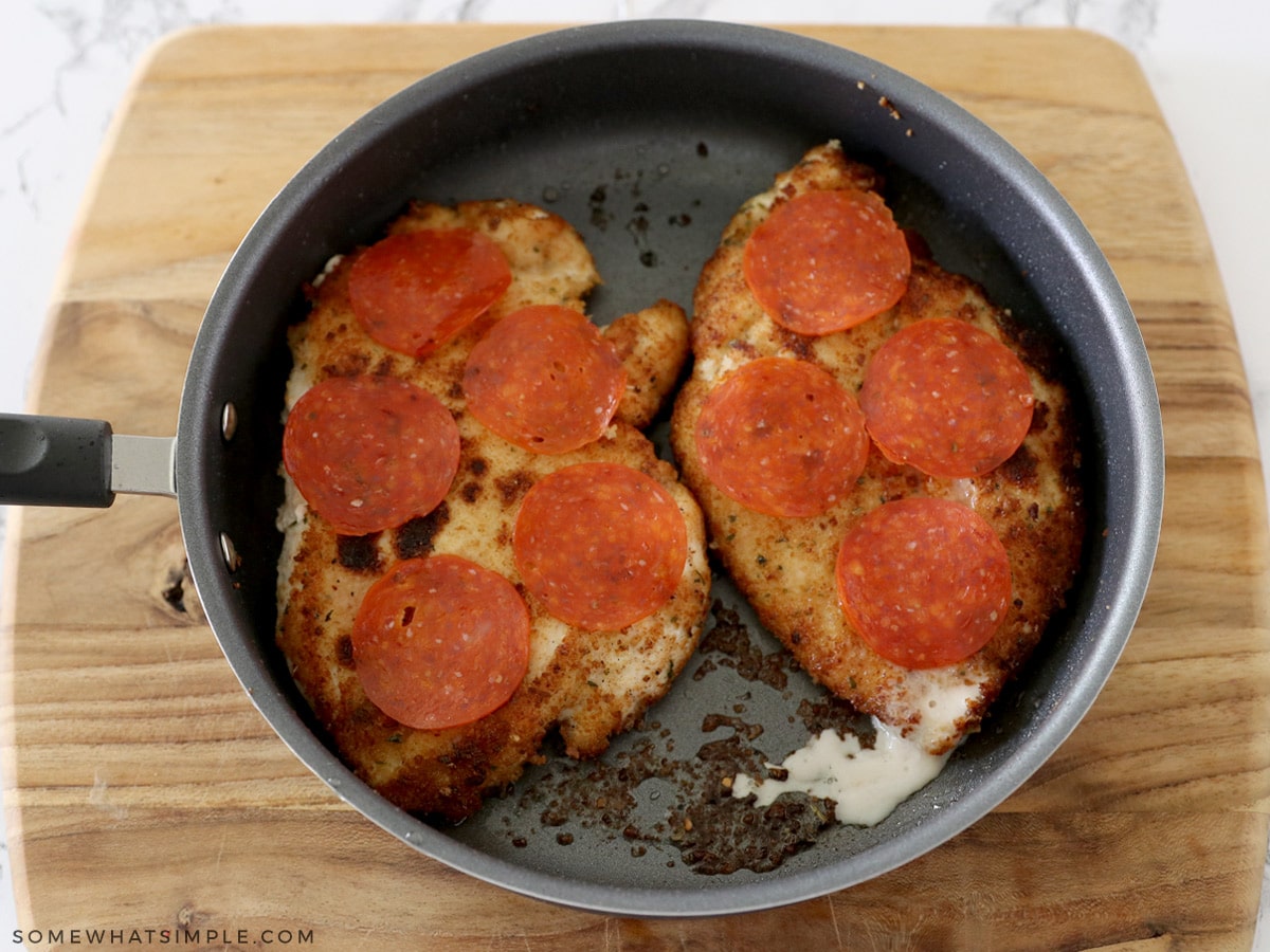 adding pepperoni to chicken breasts