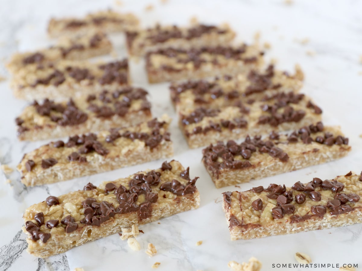 homemade granol bars laying in rows on a counter