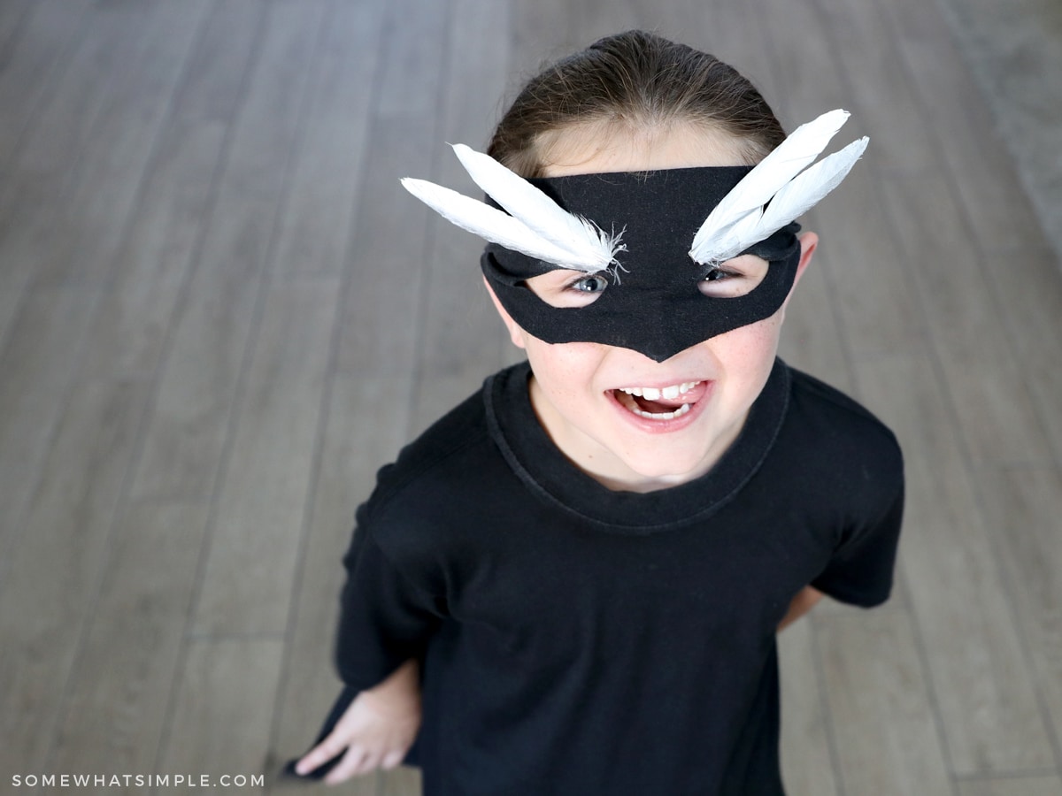 childs superhero costume with black mask