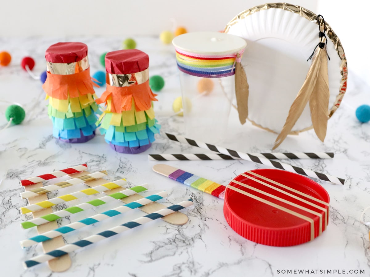 colorful homemade musical instruments on a white countertop