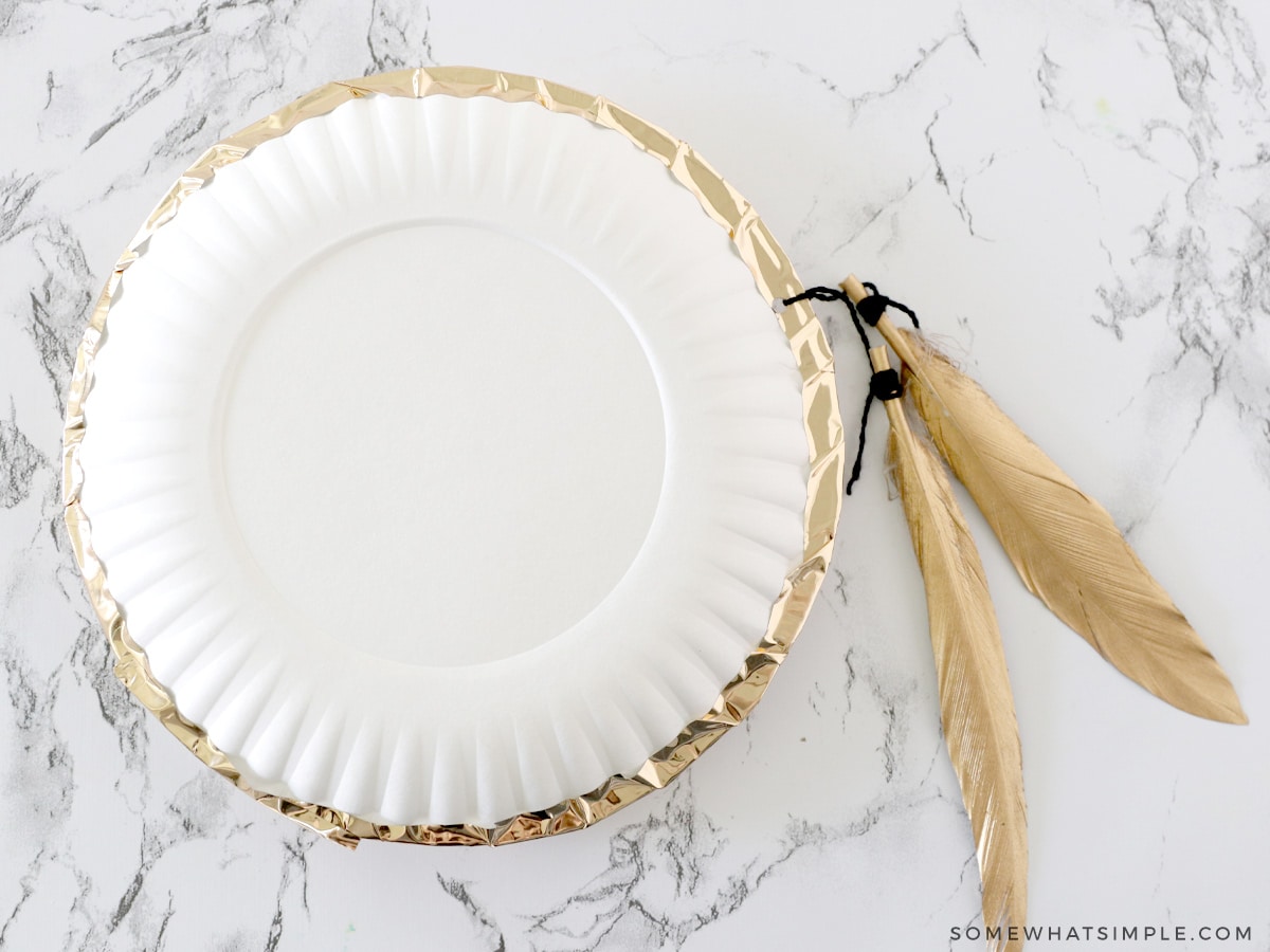 how to make a noise maker with paper plates and dried beans
