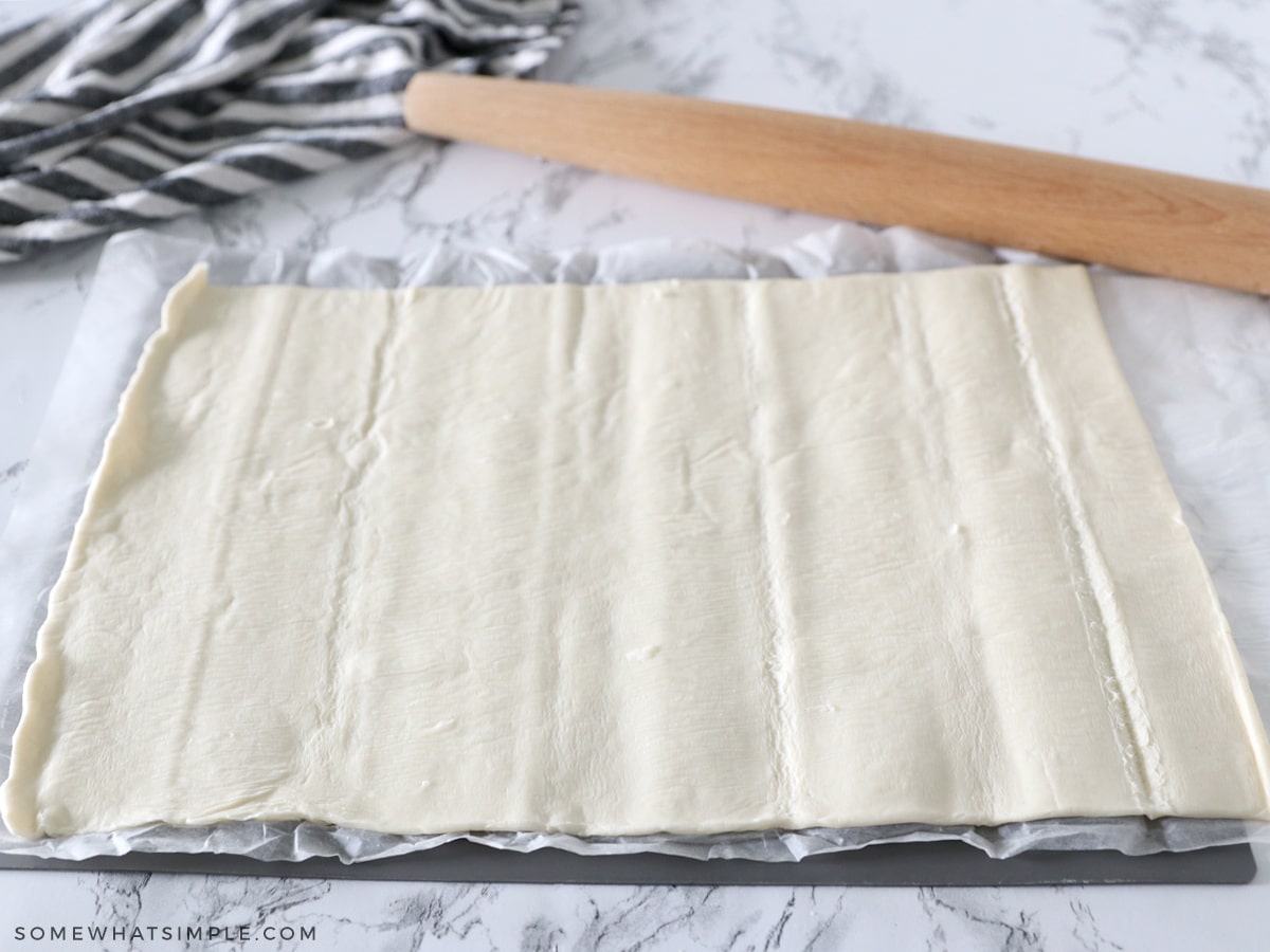 rolling out puff pastry dough