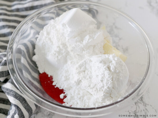 adding fresh raspberry juice to powdered sugar and butter