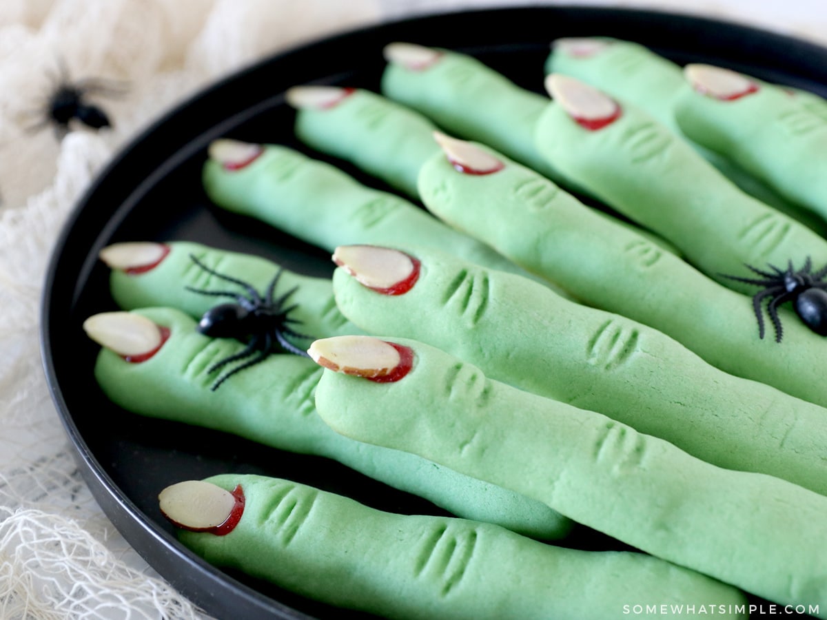 witch finger cookies on a black tray