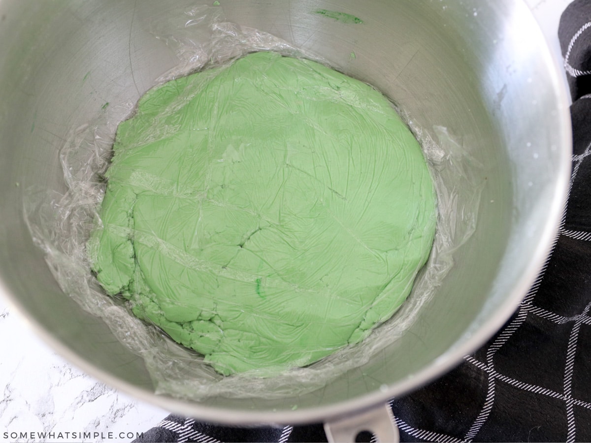 covering cookie dough with plastic wrap