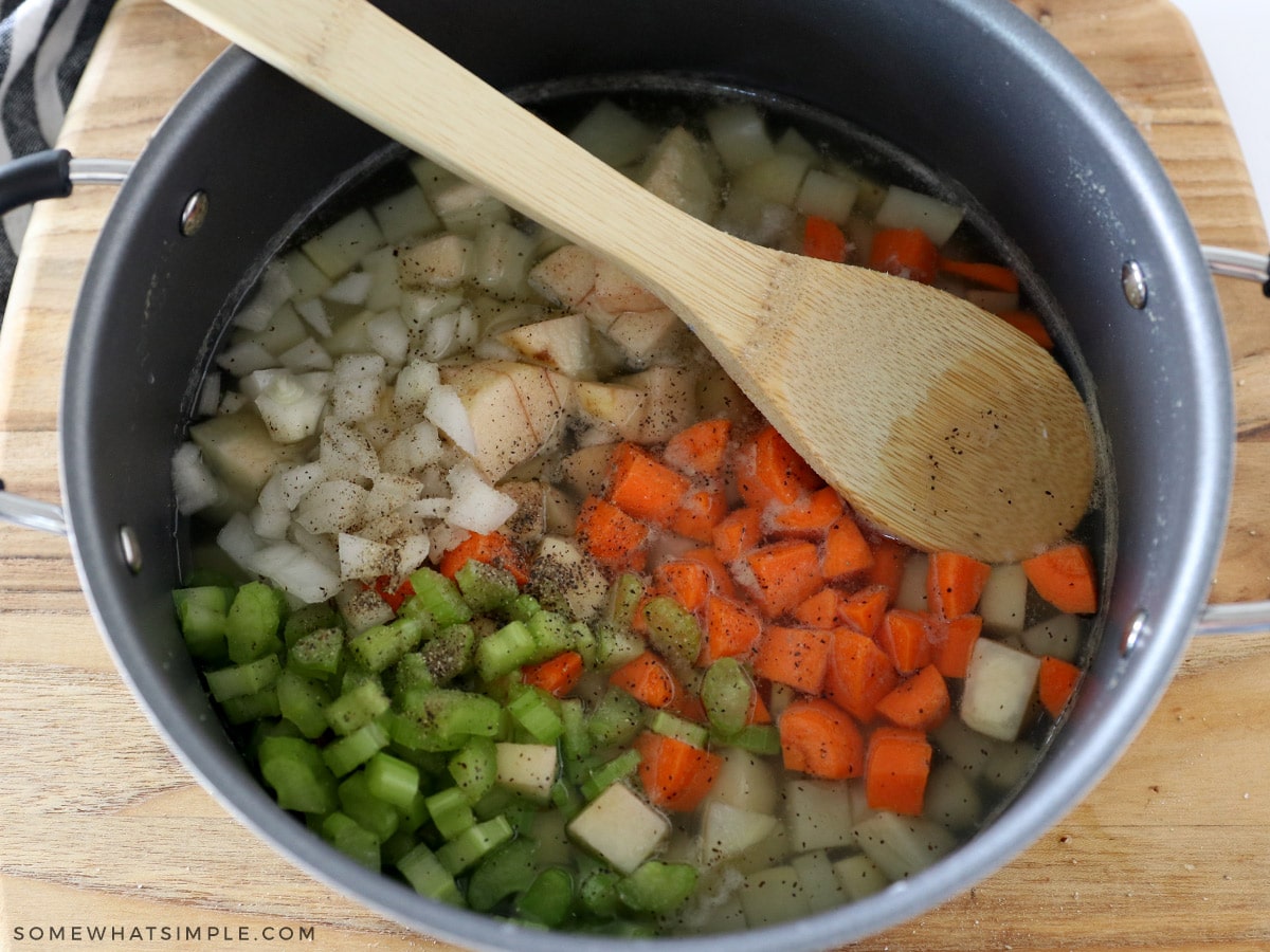 adding vegetables to boiling water