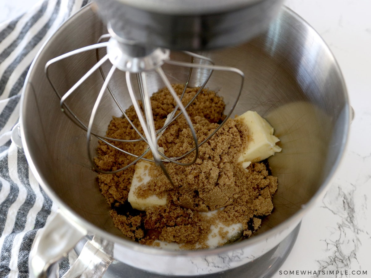 creaming together butter and sugars in a mixing bowl