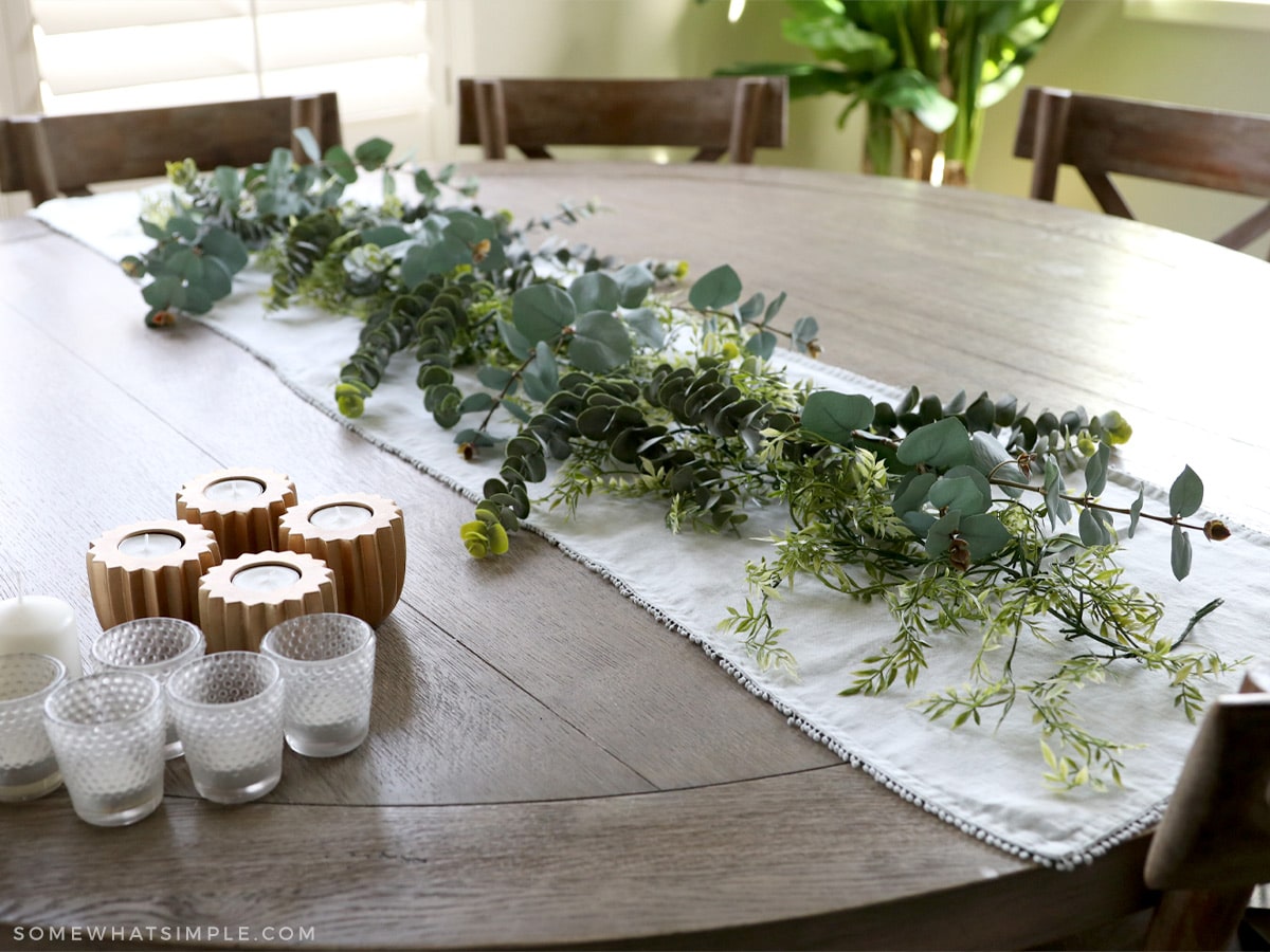 layering a fall tablescape on a wood table