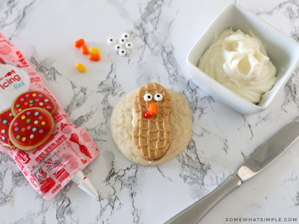 adding a turkey face to a nutter butter cookie