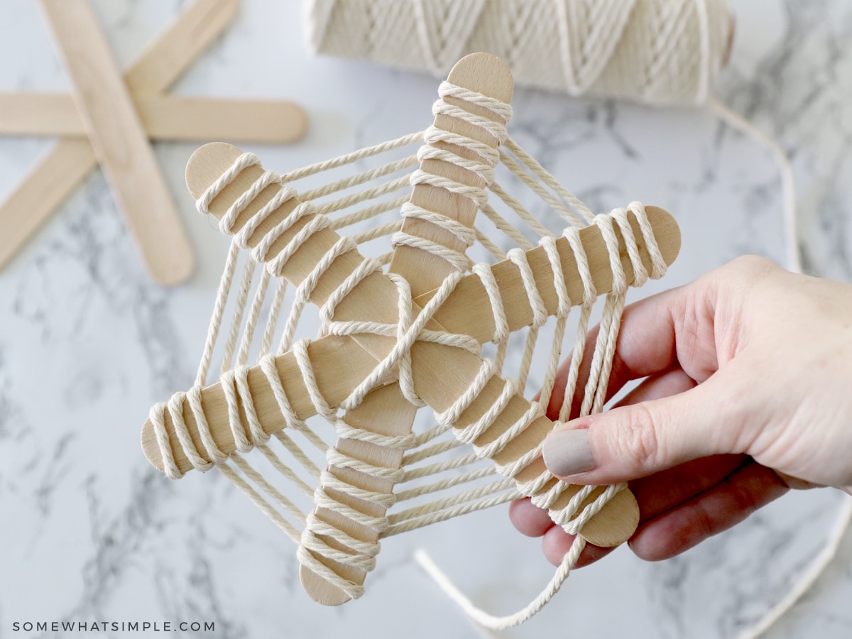 wrapping popsicle sticks in yard