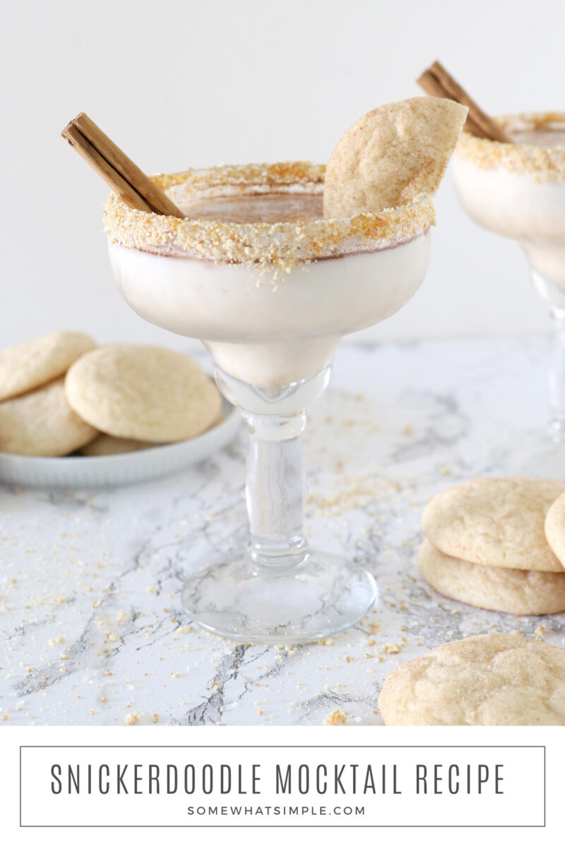 long image of a snickerdoodle mocktail with a plate of cookies behind it