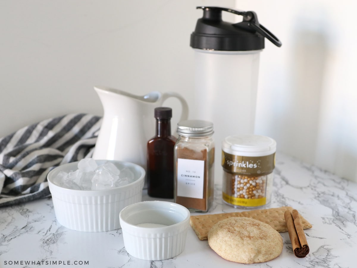 ingredients for a snickerdoodle mocktail on a white counter