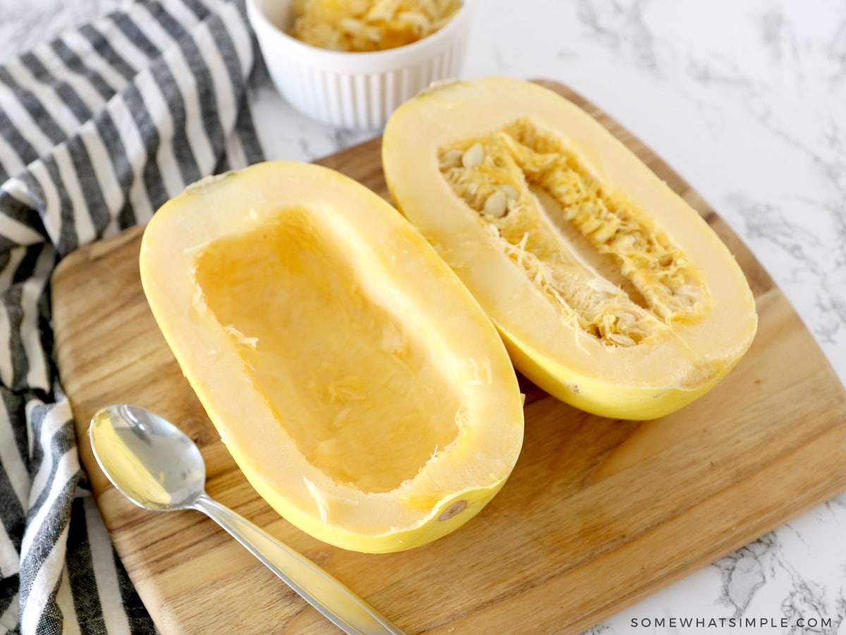 removing the seeds from a spaghetti squash with a spoon
