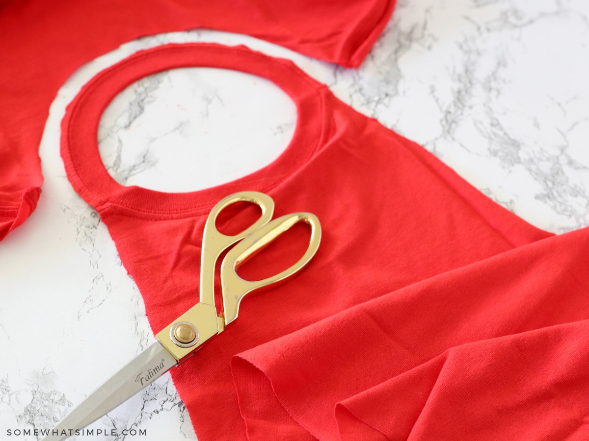 cutting a red t shirt around the collar