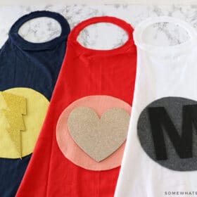 cute logos on the back of 3 superhero capes for kids