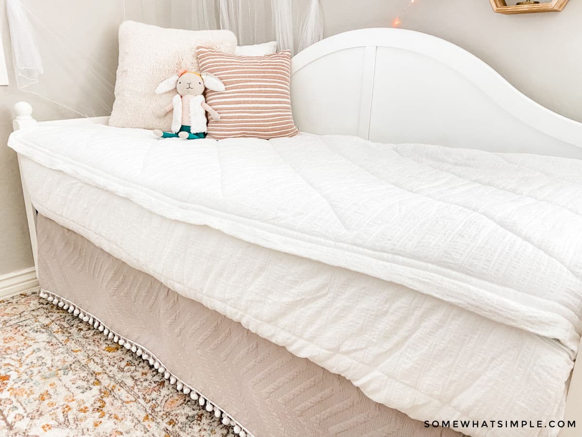 white bedding on a white daybed