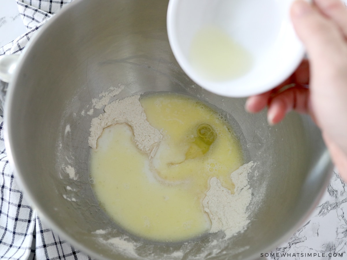 adding wet ingredients to the dry ingredients