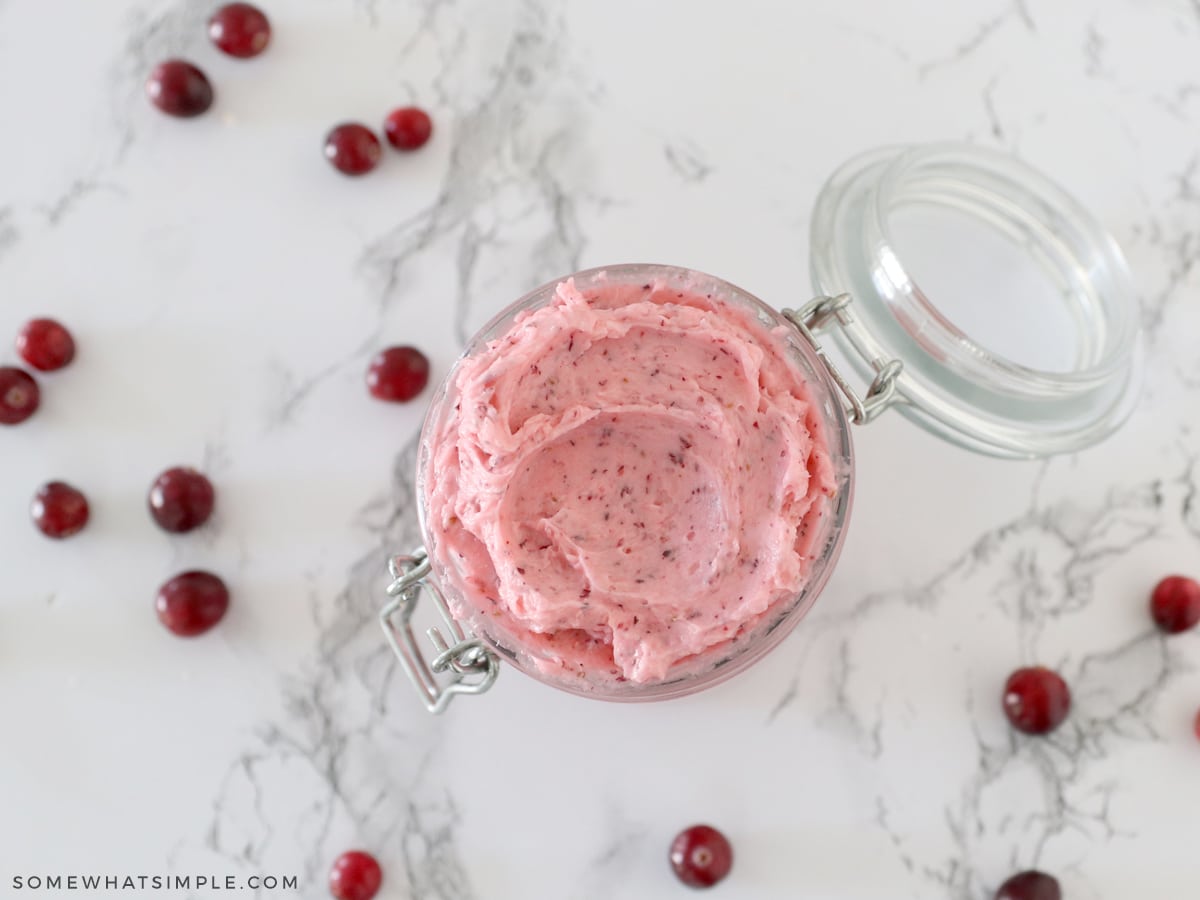 overhead shot of cranberry butter in a glass jar