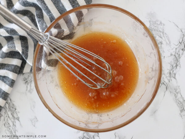 mixing hot honey in a glass bowl