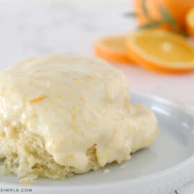 gooey orange rolls on a plate