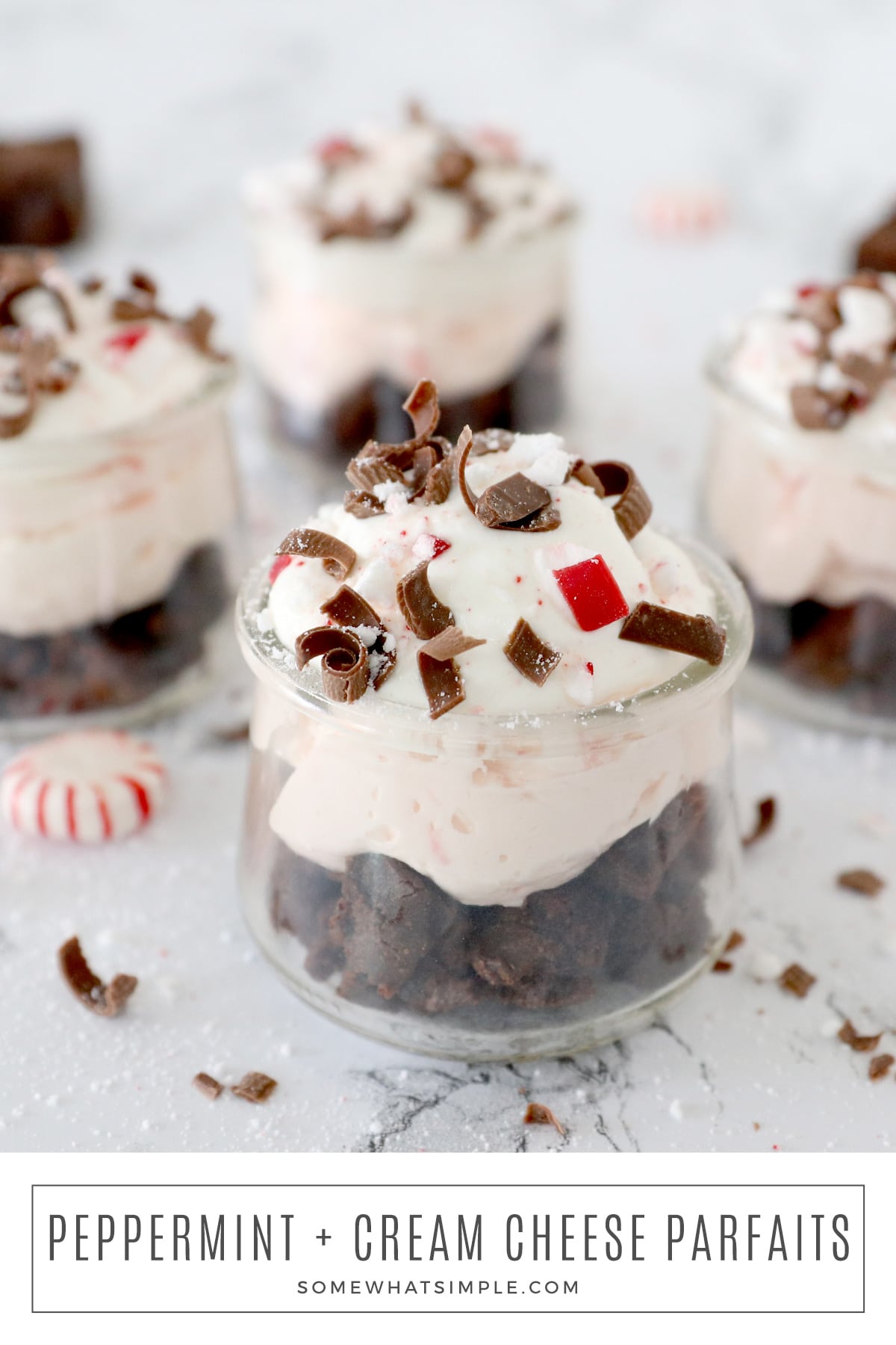 This simple peppermint parfait recipe is made with brownies, whipped cream, and a homemade cheesecake layer filled with crushed peppermint candies. These tasty little treats can be ready for your holiday festivities in just a few minutes! via @somewhatsimple