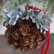 pinecone topiary ball hanging on a garland