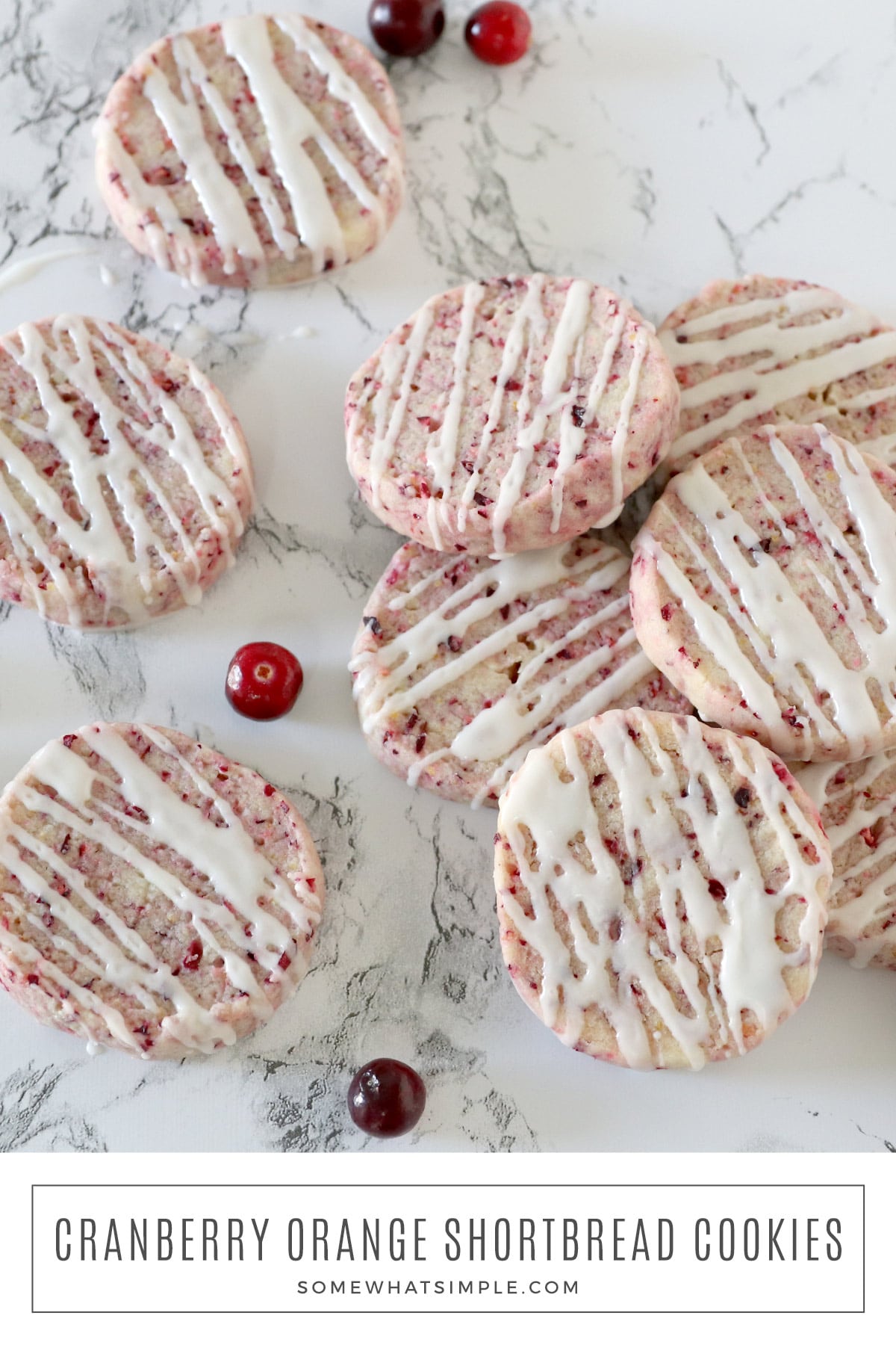 Jazz up classic shortbread cookies by adding cranberries and orange zest. These easy Cranberry Orange Shortbread cookies are great for the holidays! via @somewhatsimple