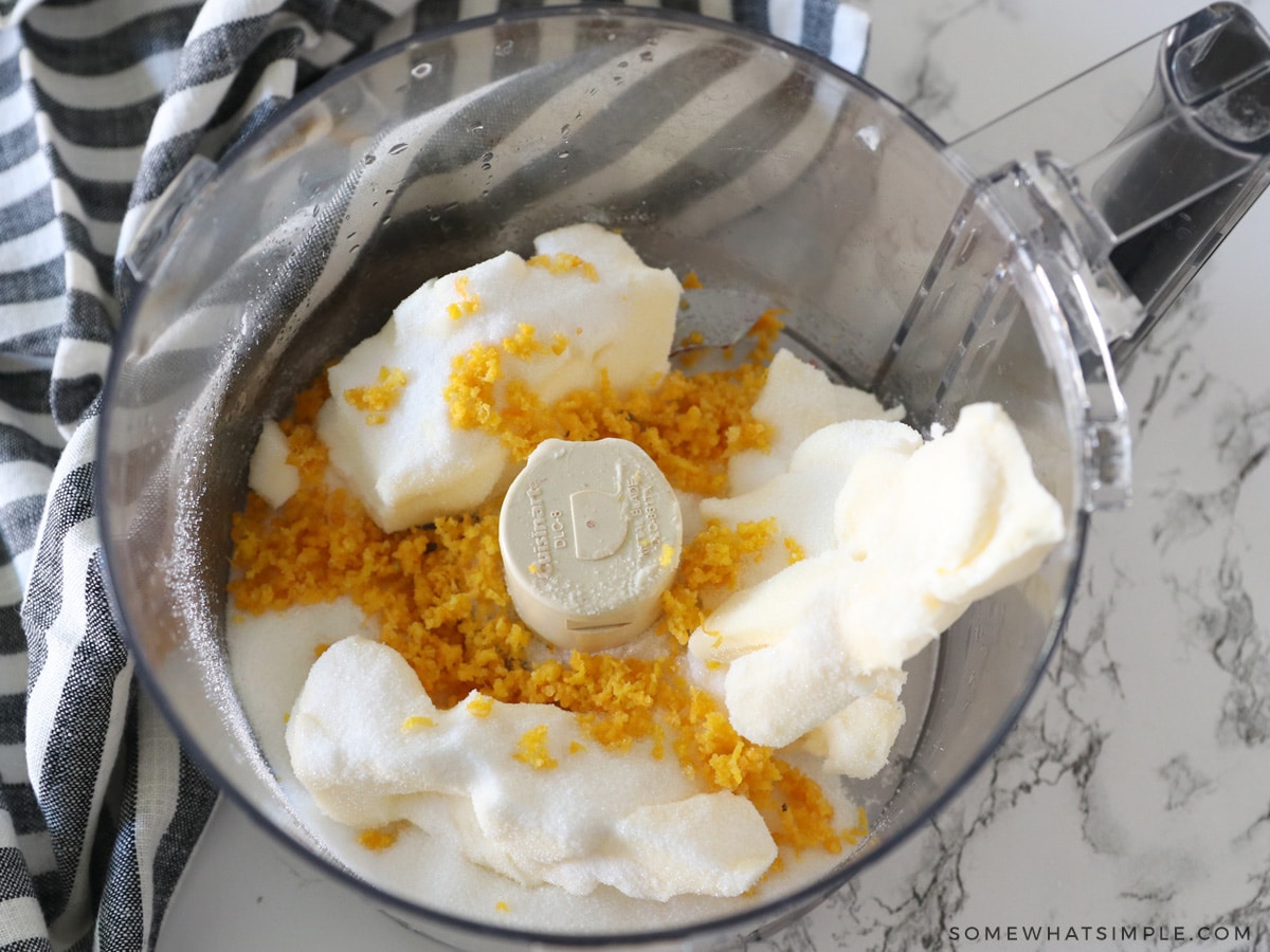 creaming butter and sugars with orange zest in a food processor