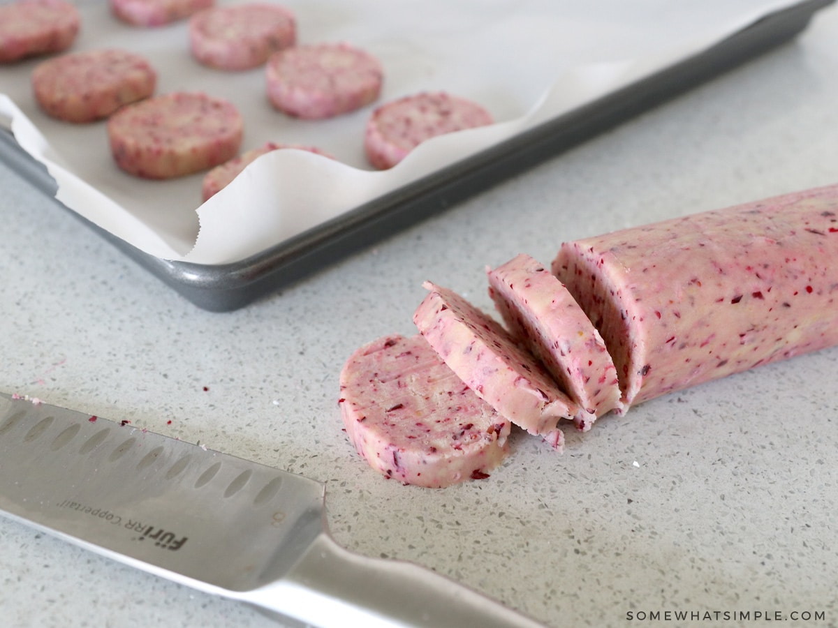 slicing dough into cookies