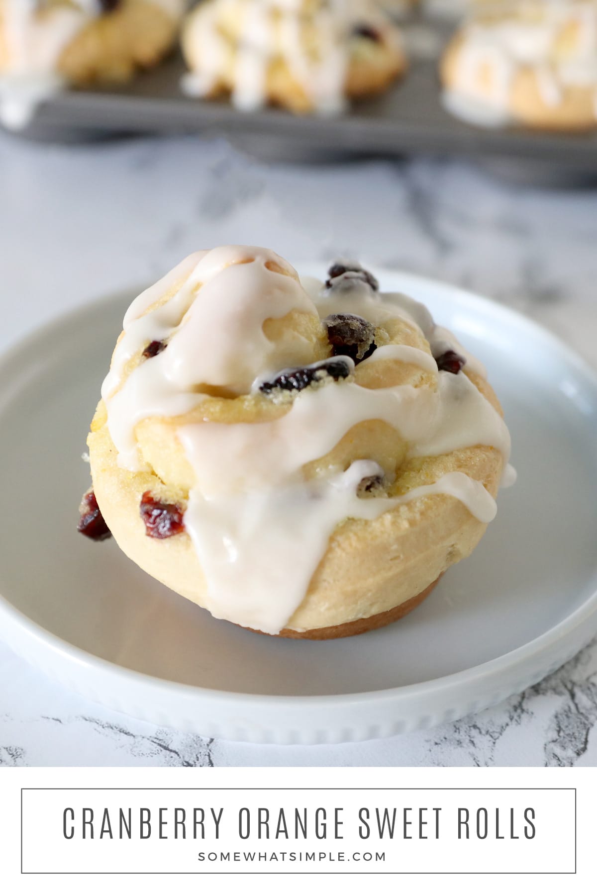 Cranberry Orange Sweet Rolls will make your holiday season a whole lot sweeter! This easy recipe can be made in less than an hour and the rolls are absolutely DELICIOUS! via @somewhatsimple