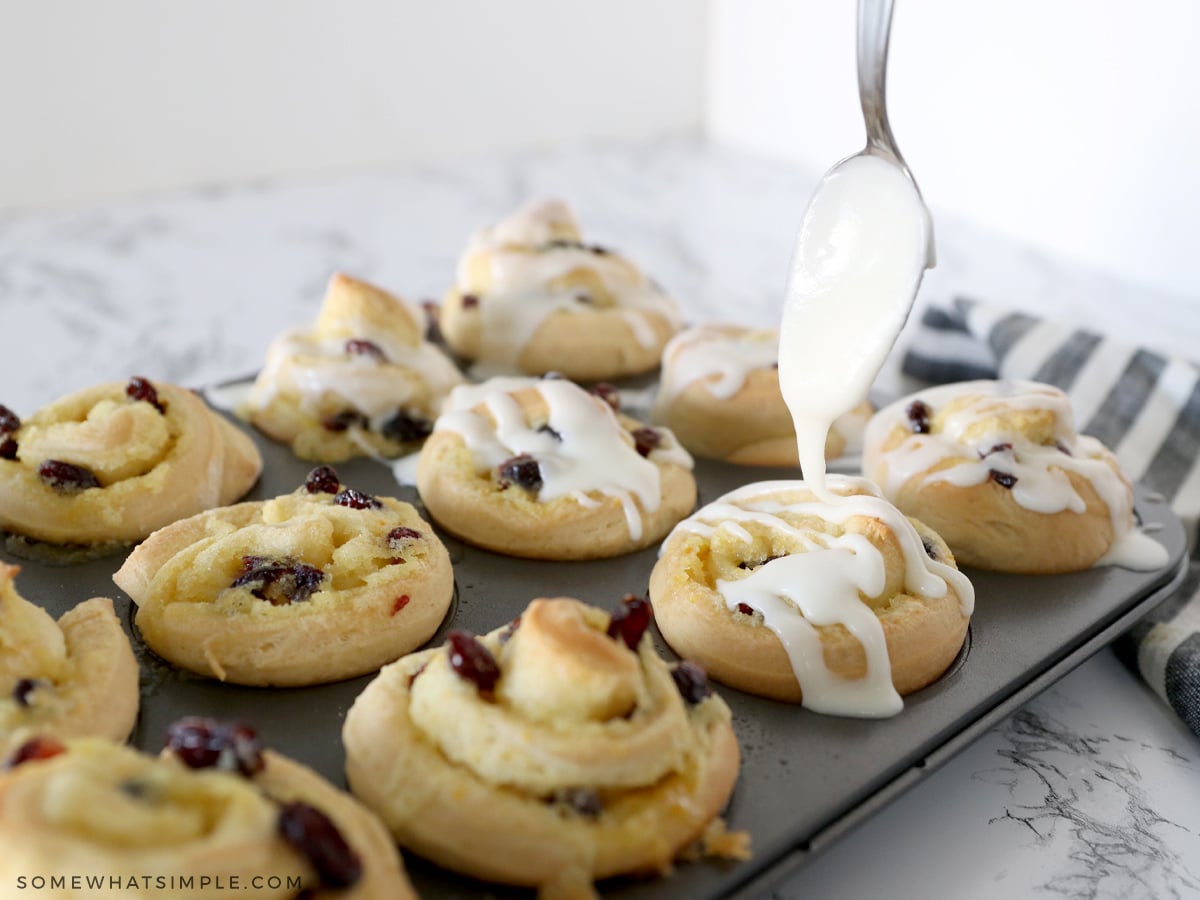 drizzling glaze over sweet rolls